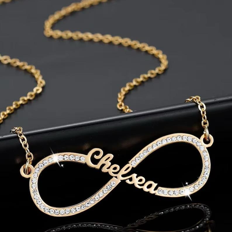Close-up of the gold Infinity Love Necklace showcasing its infinity design.