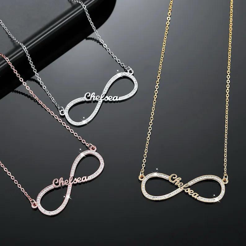 The Infinity Love Necklace displayed in gold, rose gold and silver finishes.