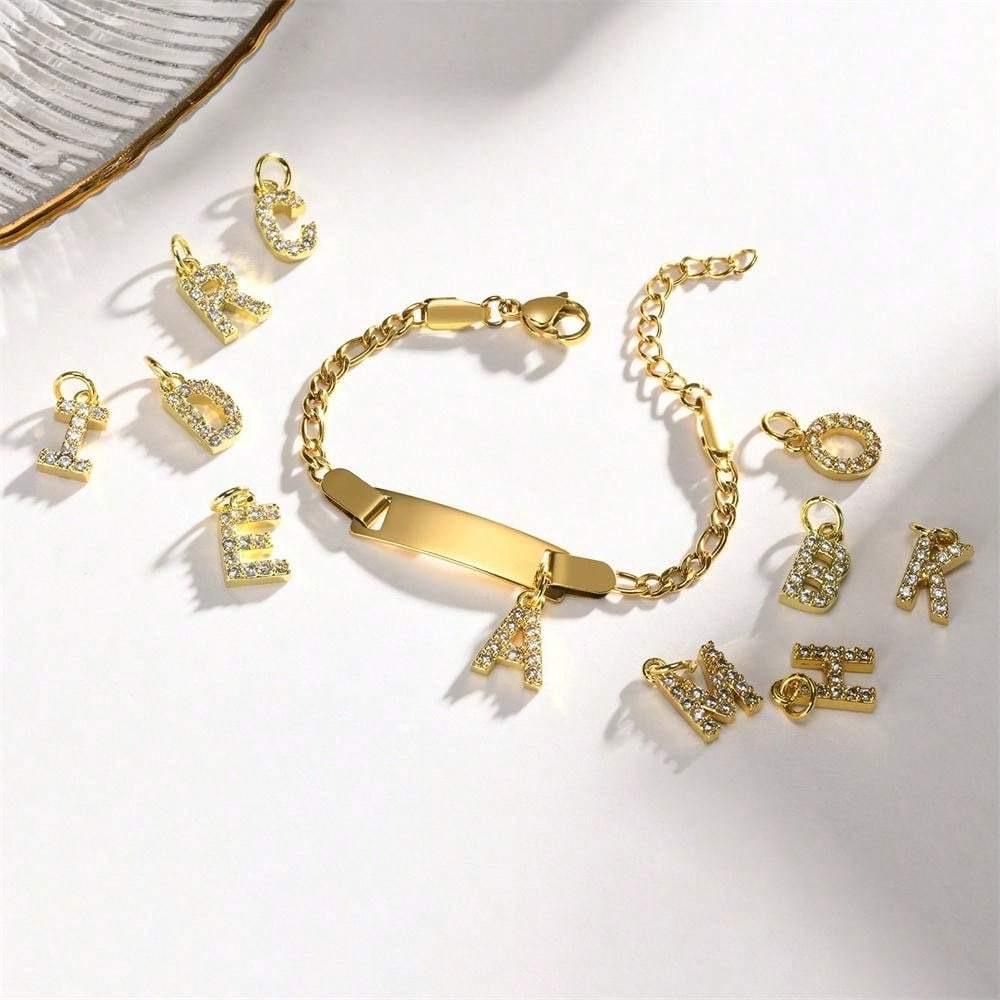 Gold Signature Letter Bracelet displayed with its decorative letter charm.
