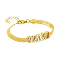 Close-up of the gold Forever Family Bracelet featuring personalised family name charms.

