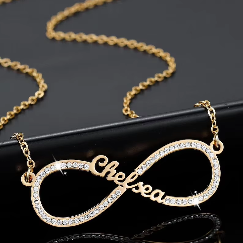 Close-up of the gold Infinity Love Necklace showcasing its infinity design.