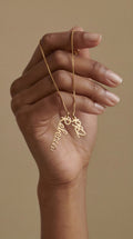 Personalised 18k gold-plated Signature Name Necklace with interlocking script nameplates reading “Rebecca” and “1982”, by For KeepSake.